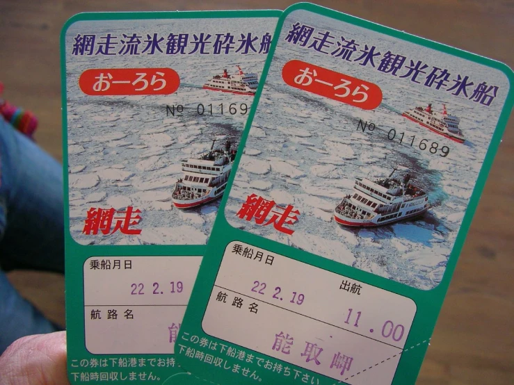 two travel tickets for a cruise ship traveling in the sea