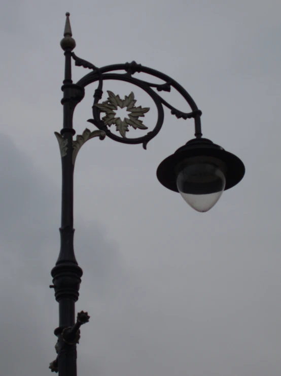 the lamp is on top of the pole