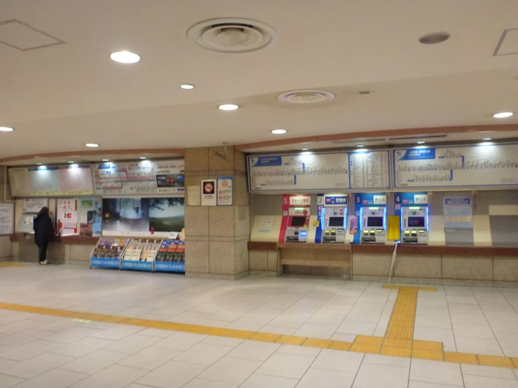 an empty building with a man walking in it