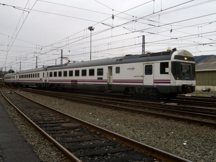 a train sitting on train tracks near a station