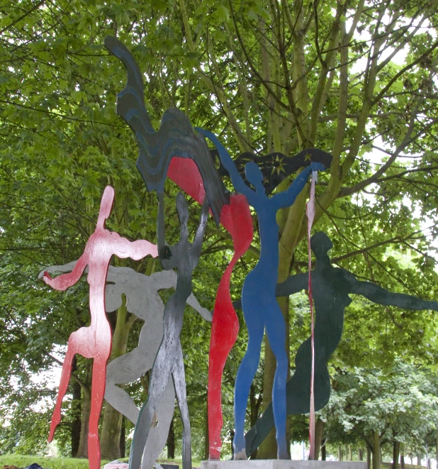 an art installation with a large colorful abstract artwork on the grass