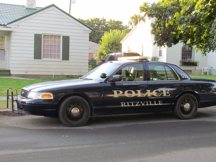 police car parked on the side of the road