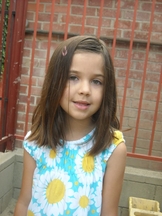 a  standing in front of a gate