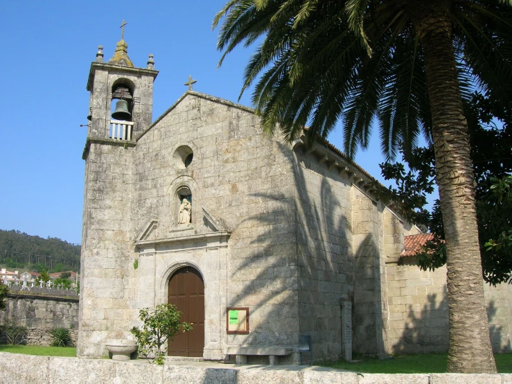 this is an old stone church in a tropical setting