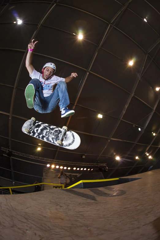 the skateboarder is performing a trick in the air