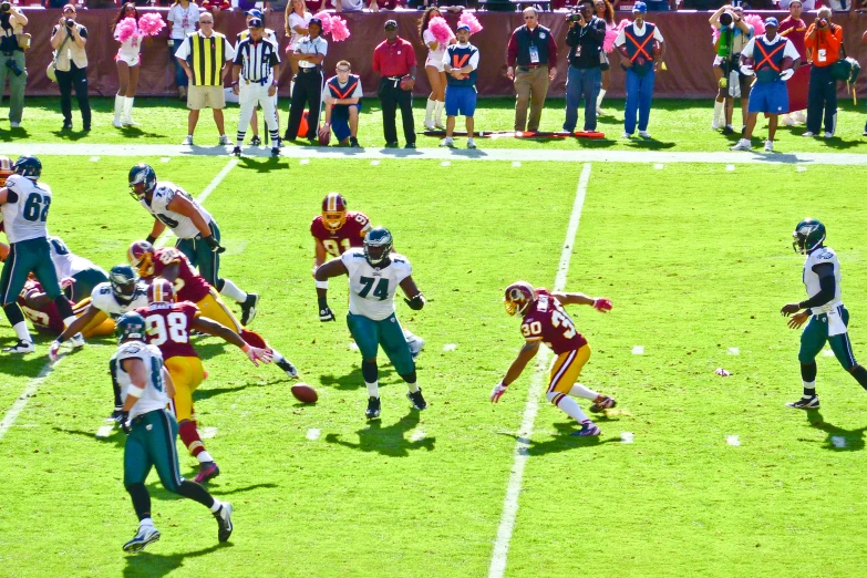 a football player running after an interception