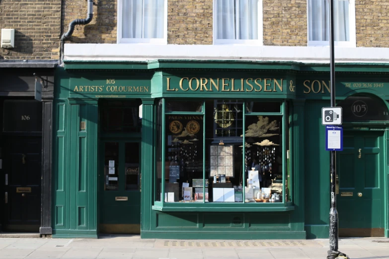 the outside of a store with lots of bottles on display