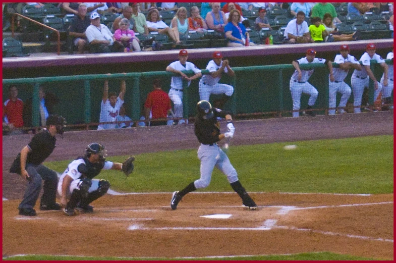 the baseball players are playing baseball at the field