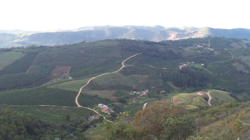 a winding trail is on the side of a mountain