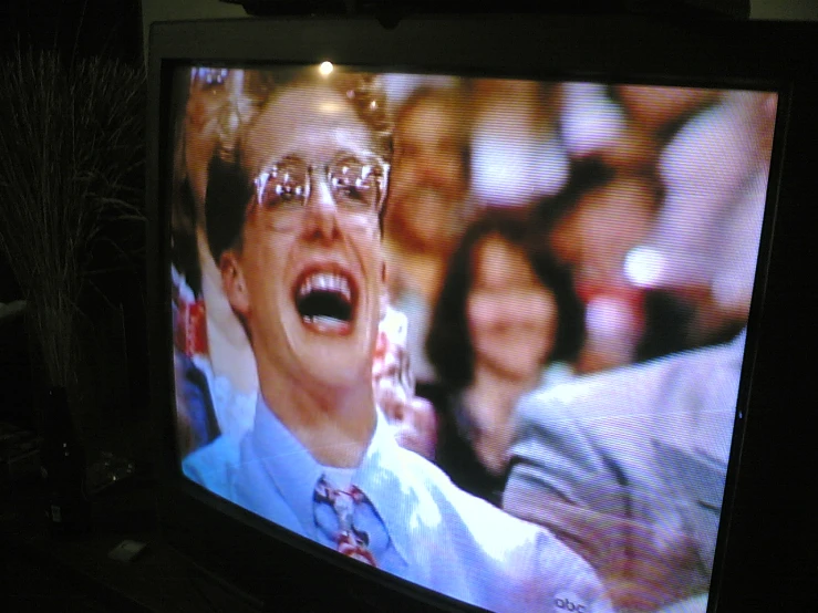a young man is screaming while on television