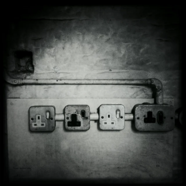 a close up of the electrical wiring on a wall