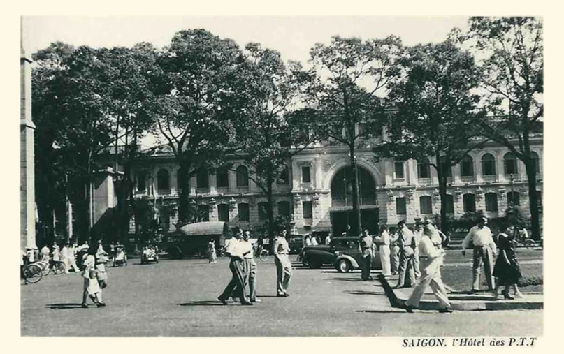 people standing on a street in front of buildings