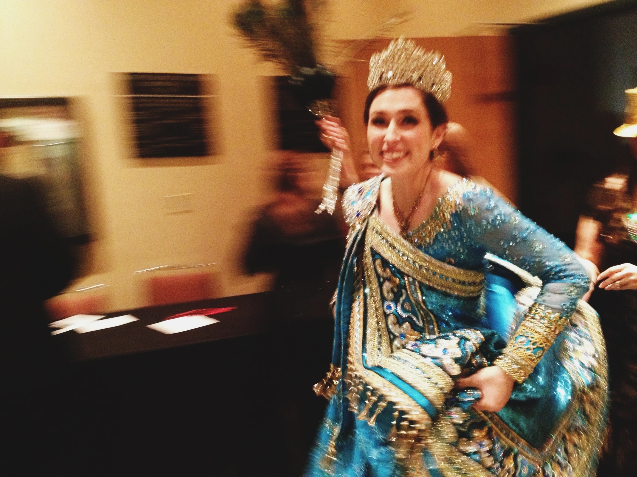 a woman in a costume is walking down the street