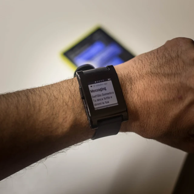 a close up of a person with a wrist watch