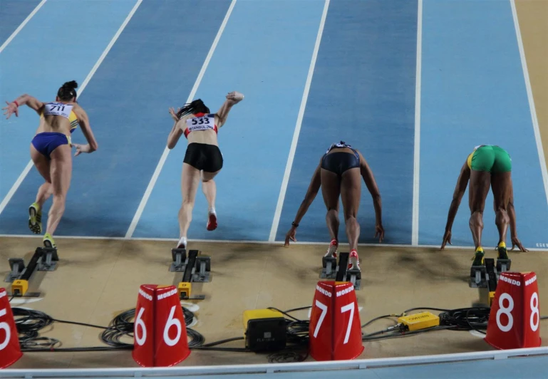 some female athletes are competing at a track