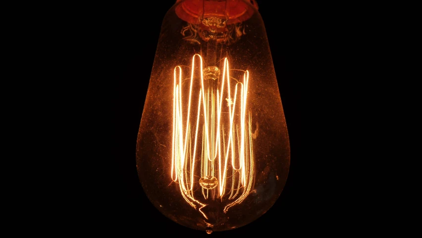 lightbulb on a dark background with orange glow