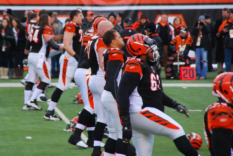 several players standing on the field in uniforms