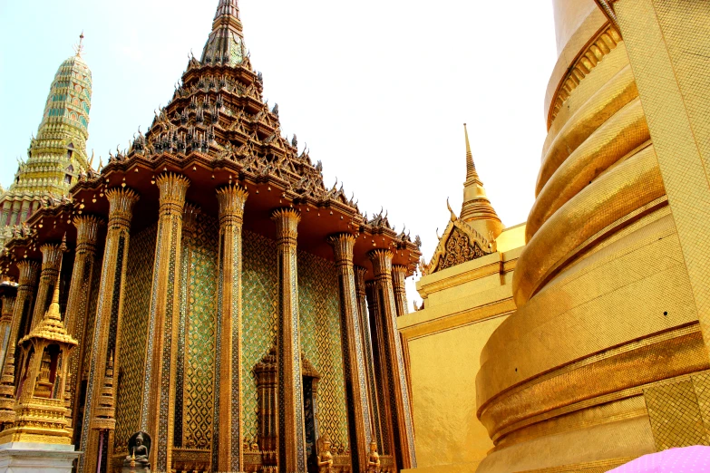 the gold temple building is very ornate and colorful