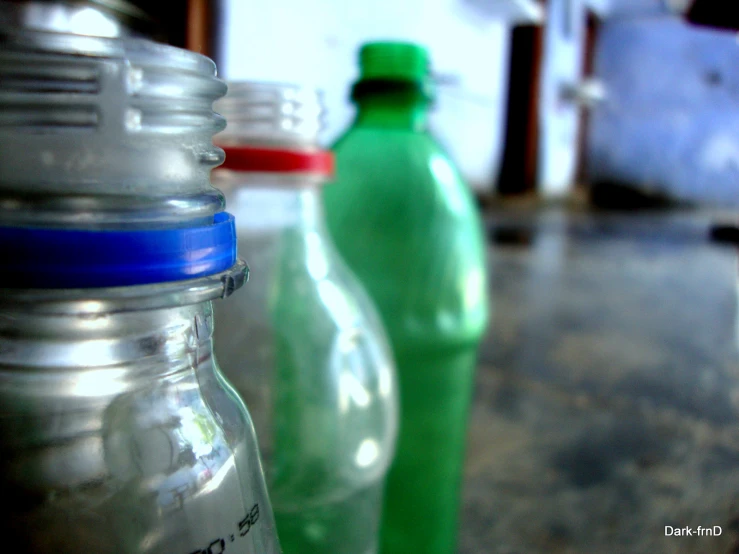 two bottles sitting next to each other on a table