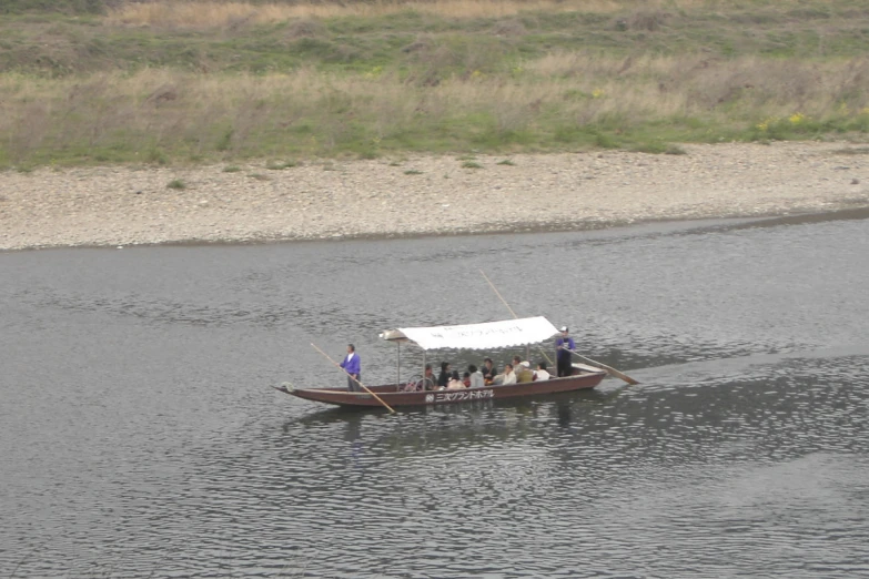 some people in a boat in the middle of water