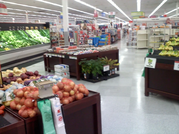 a grocery store filled with fruits and vegetables