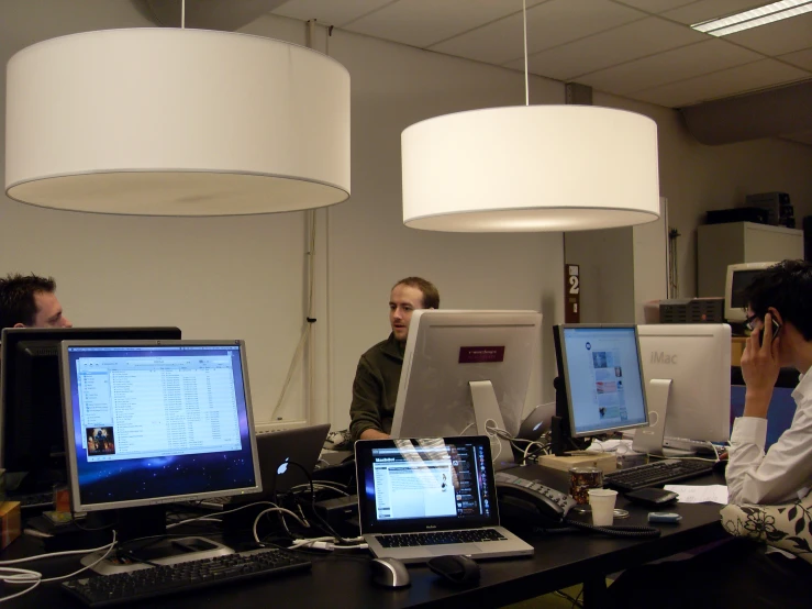 a table with many computers sitting on it