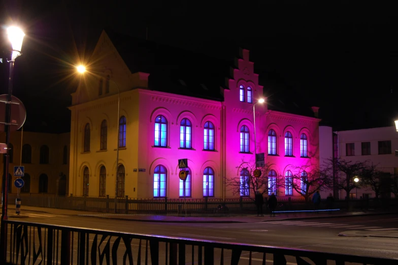 a building illuminated up with colorful lights