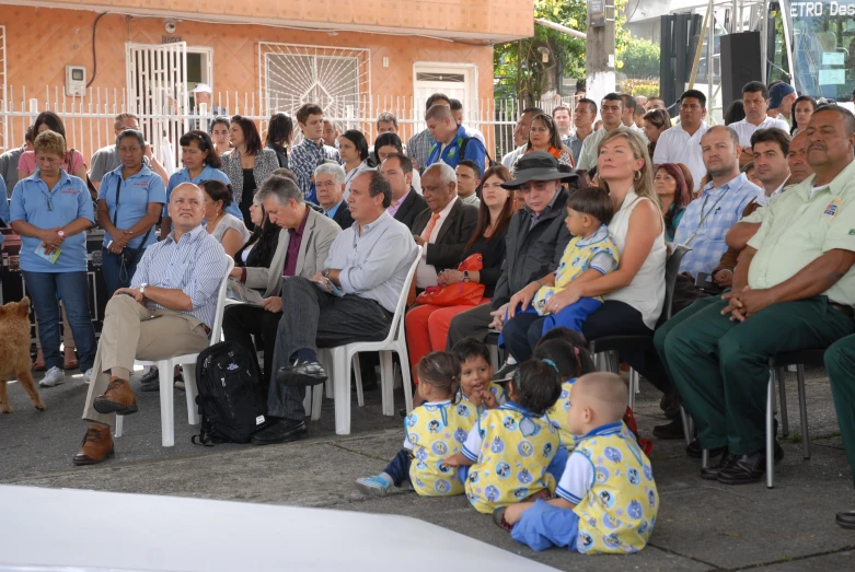 people are gathered at a small town gathering