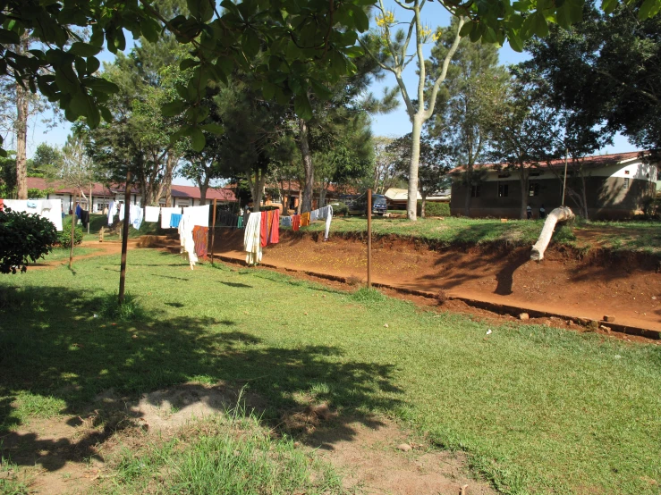 many clothes hung on lines in a yard