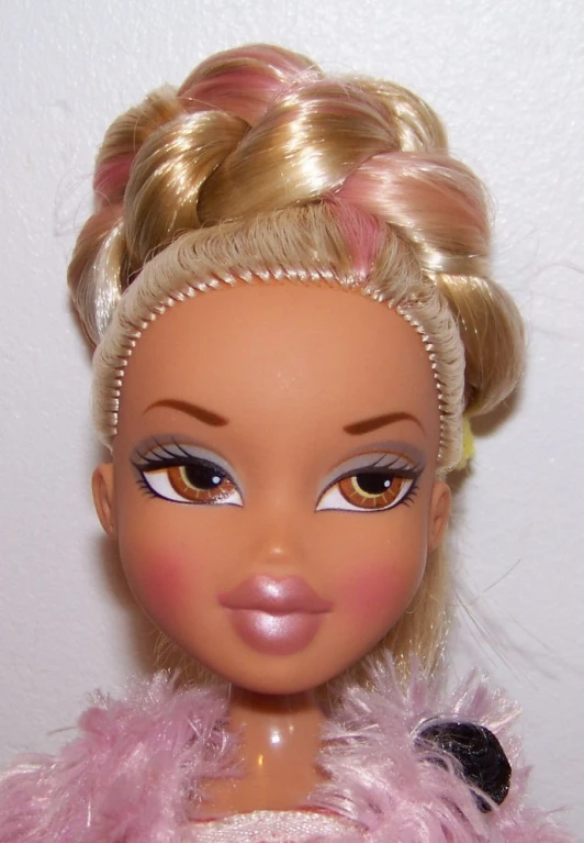 a close up of a barbie doll with an interesting pink dress