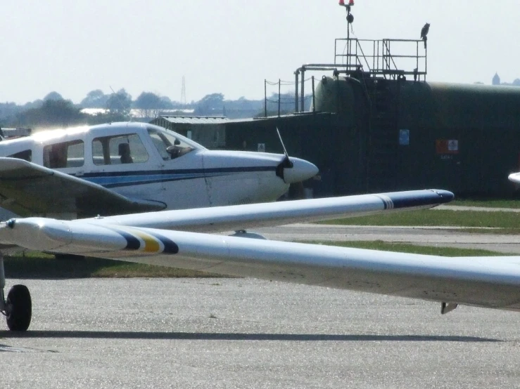 a couple of planes that are sitting on the ground