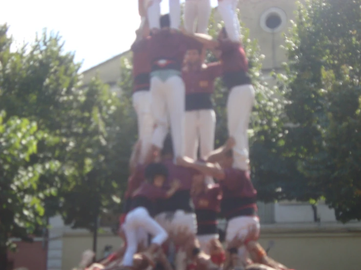 this is a picture of people standing on top of the statue