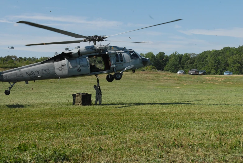 a helicopter that is parked on some grass