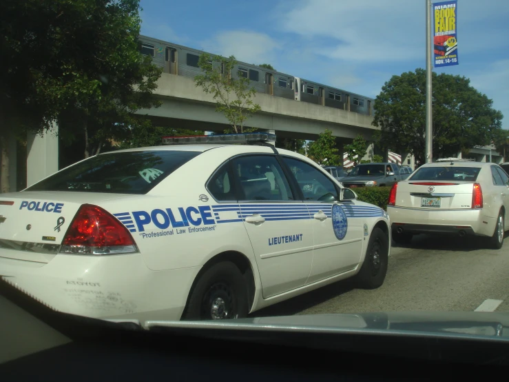 the police car and police car are all parked on the side