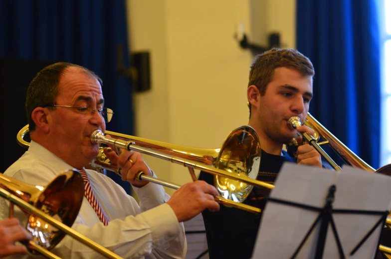 the band plays with their instruments while performing