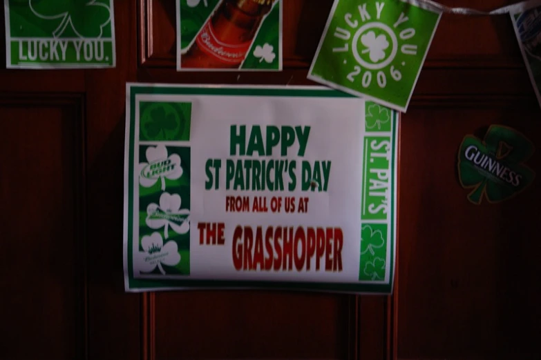 a st patrick's day sign hangs on a door