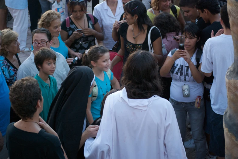 there are several girls standing together at the event