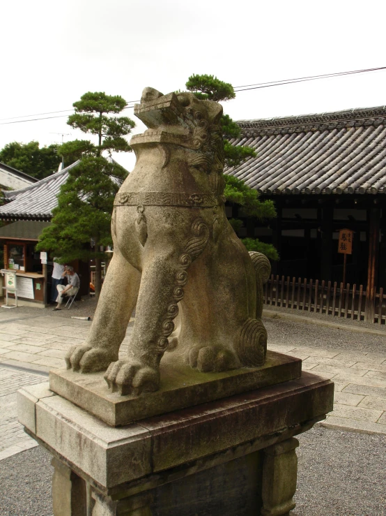 a statue of two animals sitting next to each other