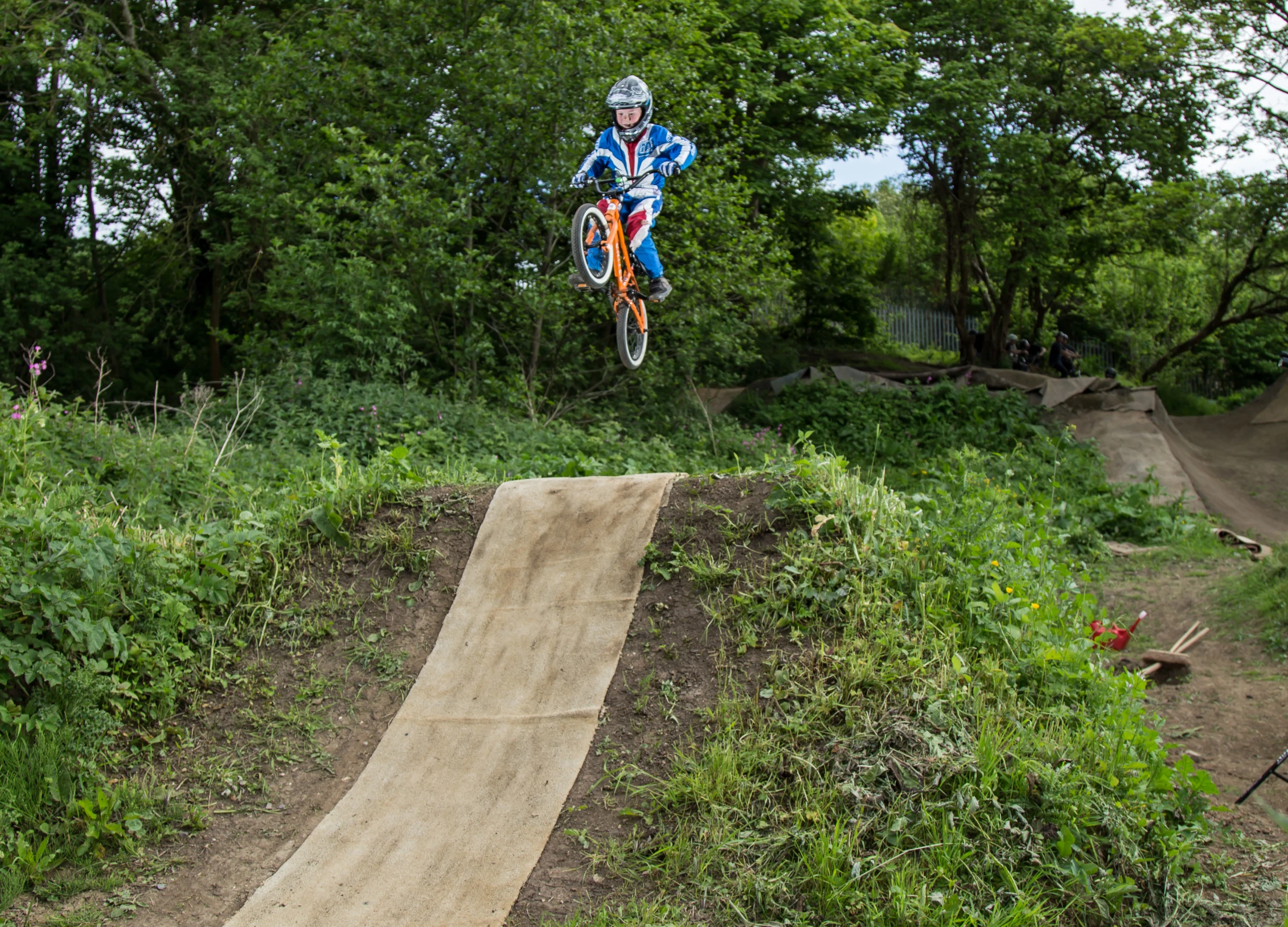 a man jumping in the air while riding a bike