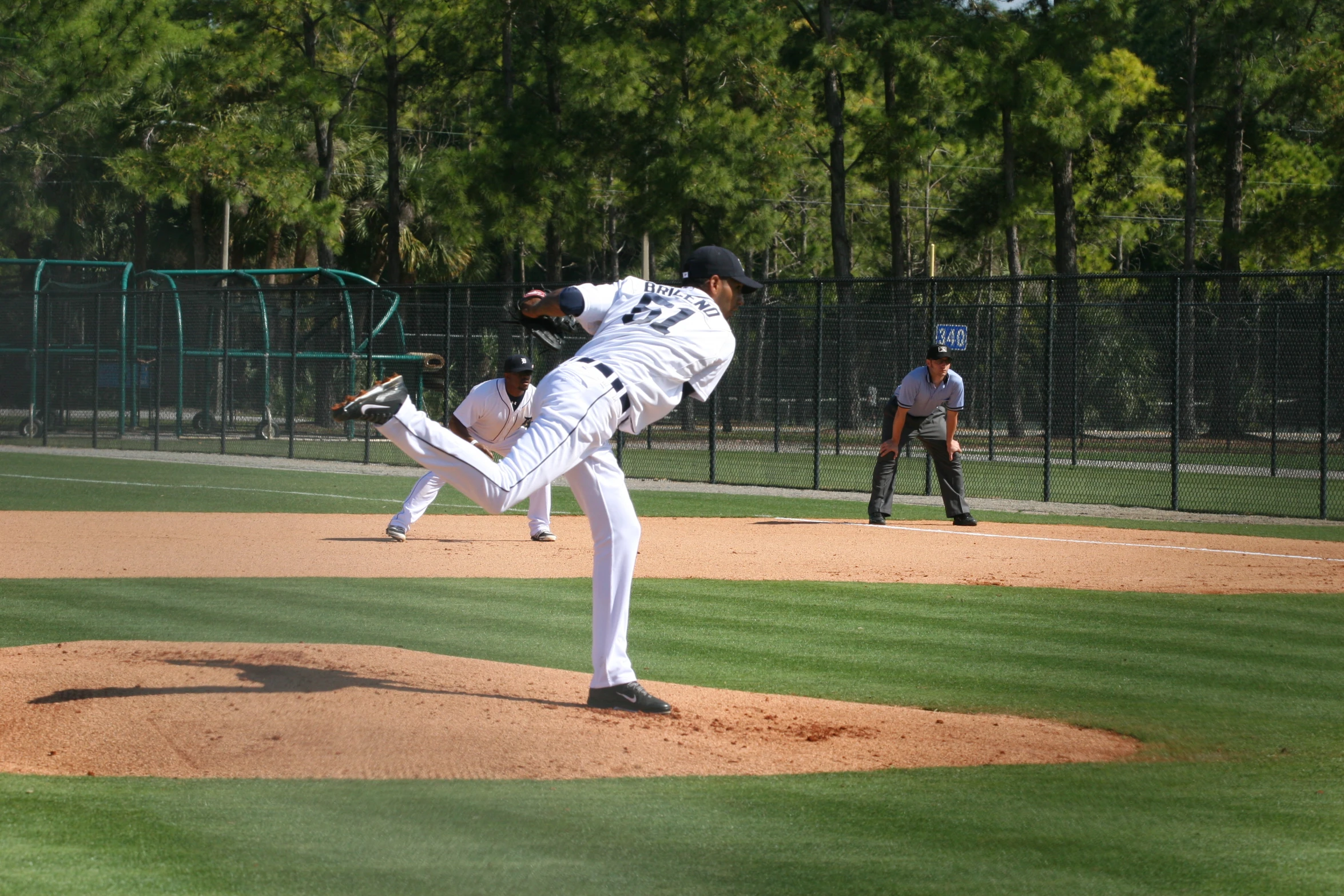 baseball pitcher throwing the ball from pitchers mound