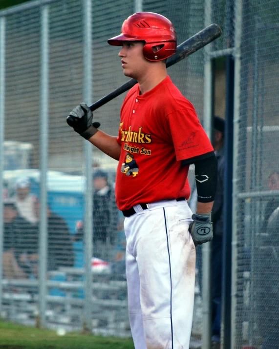 the boy is at bat getting ready to bat