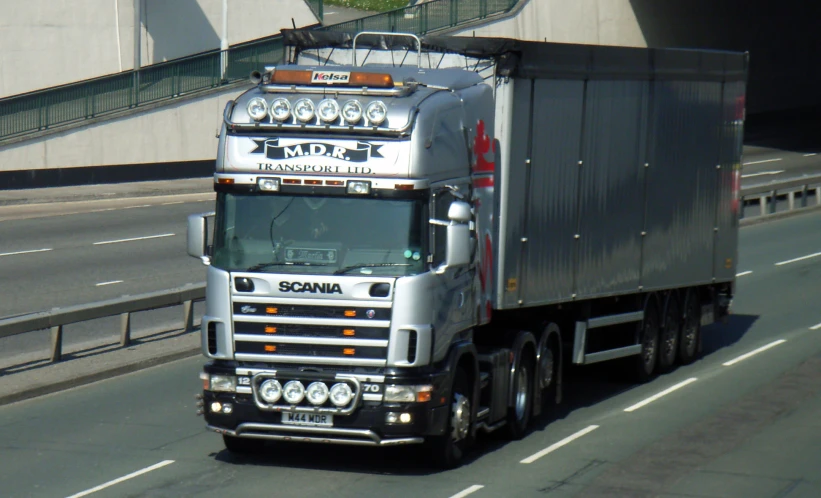 the truck is on the highway on the side of the road