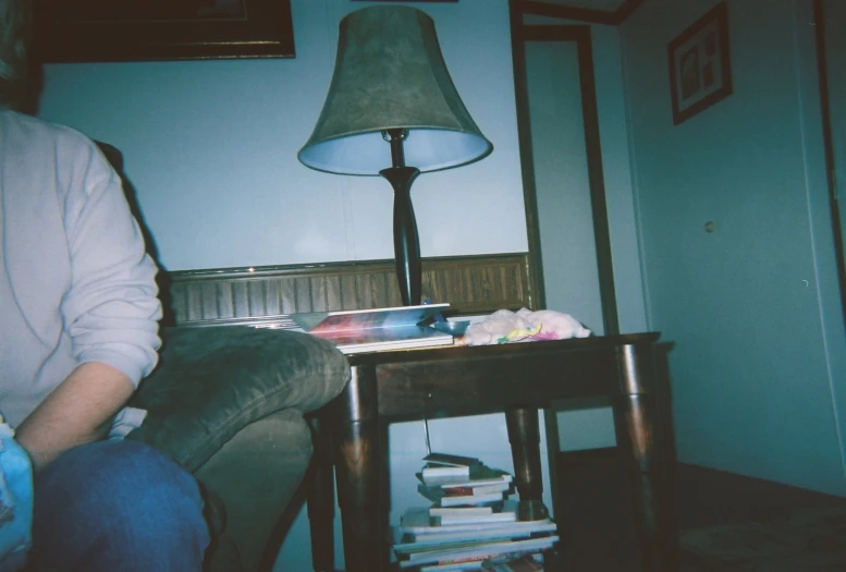 a person sitting in a chair near a table