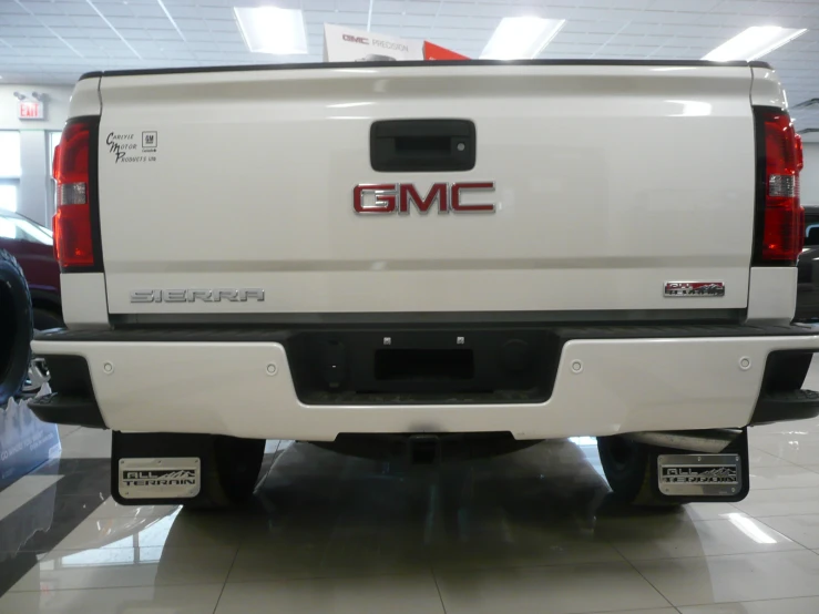 the back end of a truck on display in a dealers showroom