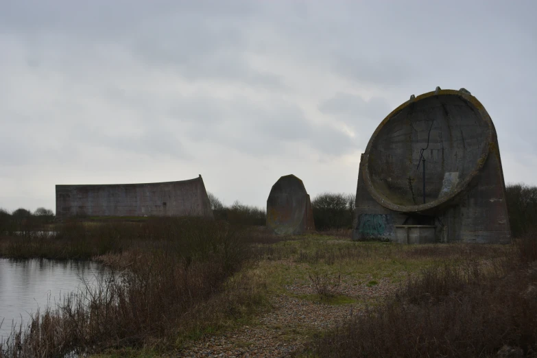 a body of water with an old structure next to it