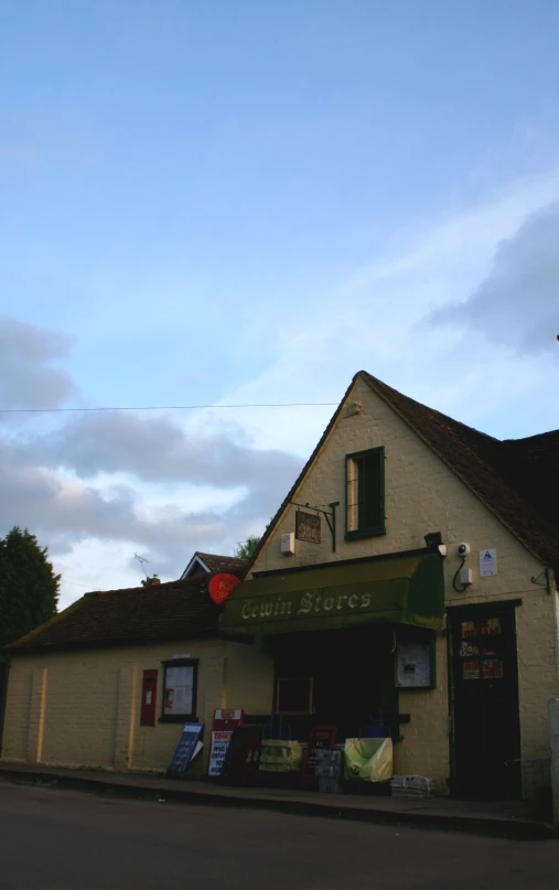 a store front is shown with various items around it