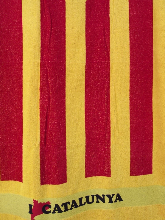 a red and yellow towel with a name on it