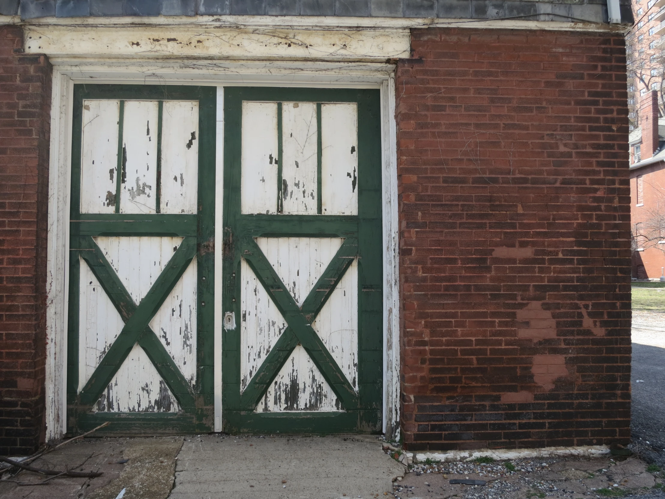 an old, crumbling door on a brick building