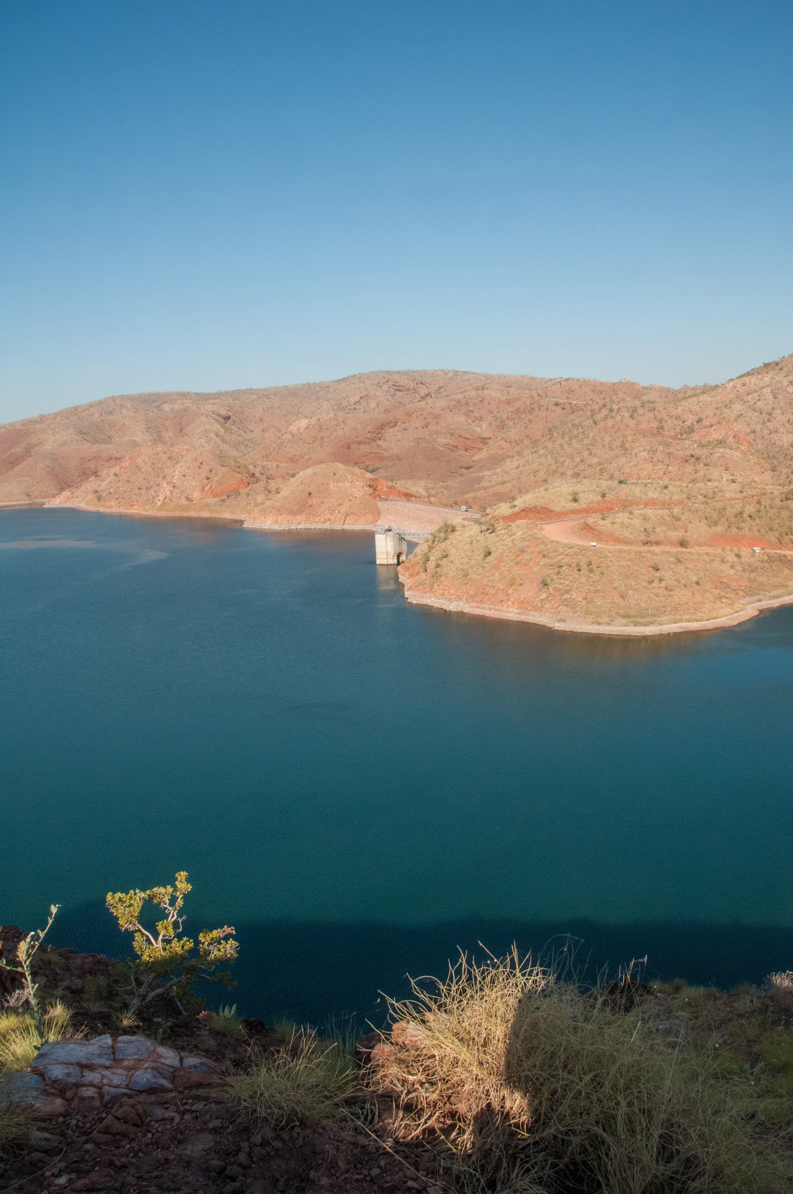 the landscape shows mountains and water with an underbelly