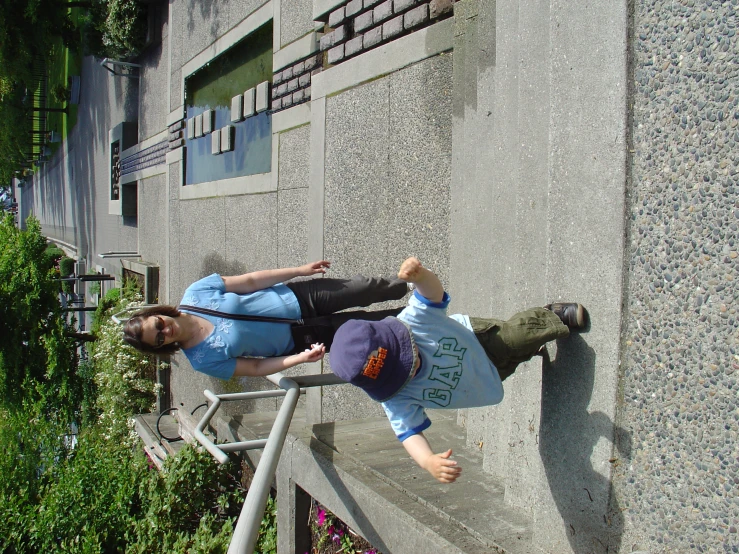 a  and girl climbing up stairs